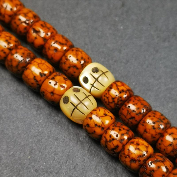 1 Pair of Fish Bone Skull Beads 0.3" - Tibetan Buddhist art, front view