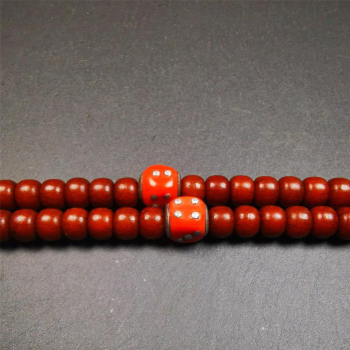 1 Pair of Plastic Dice Beads 0.47" - Tibetan Buddhist art, close-up detail