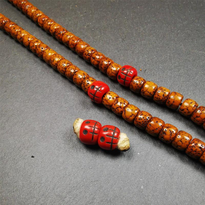 1 Pair of Plastic Skull Beads 0.4" - Tibetan Buddhist art, front view
