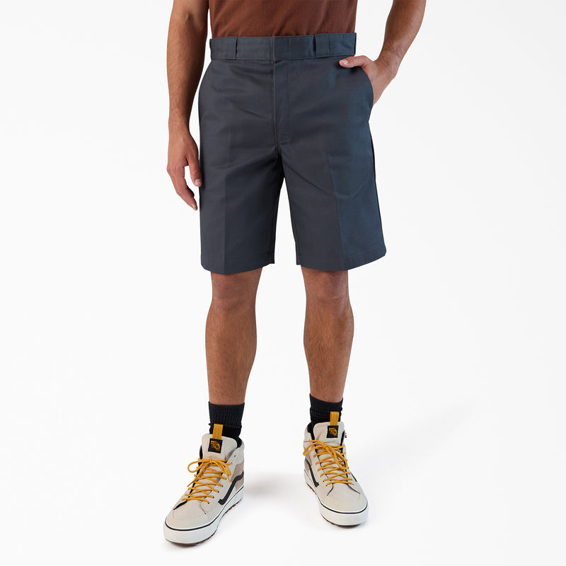 Men's dark charcoal 11-inch shorts, straight hem, worn with sneakers