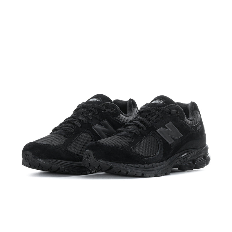 Men's black lace-up sneakers with mesh upper and textured rubber outsole