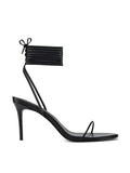 Femme LA 3.0 Barely There Lace Up in Noir – side profile showing single thin toe strap, multi-strand lace-up ankle cuff with bow, and slim stiletto heel