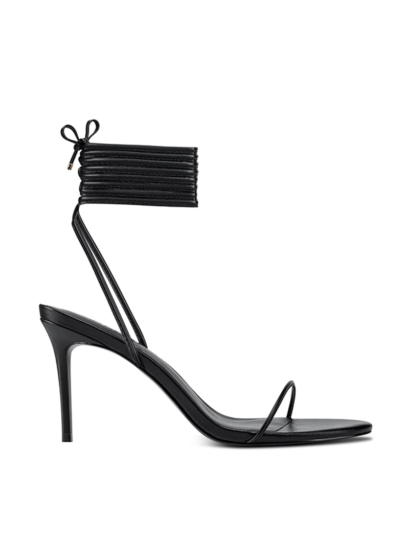 Femme LA 3.0 Barely There Lace Up in Noir – side profile showing single thin toe strap, multi-strand lace-up ankle cuff with bow, and slim stiletto heel
