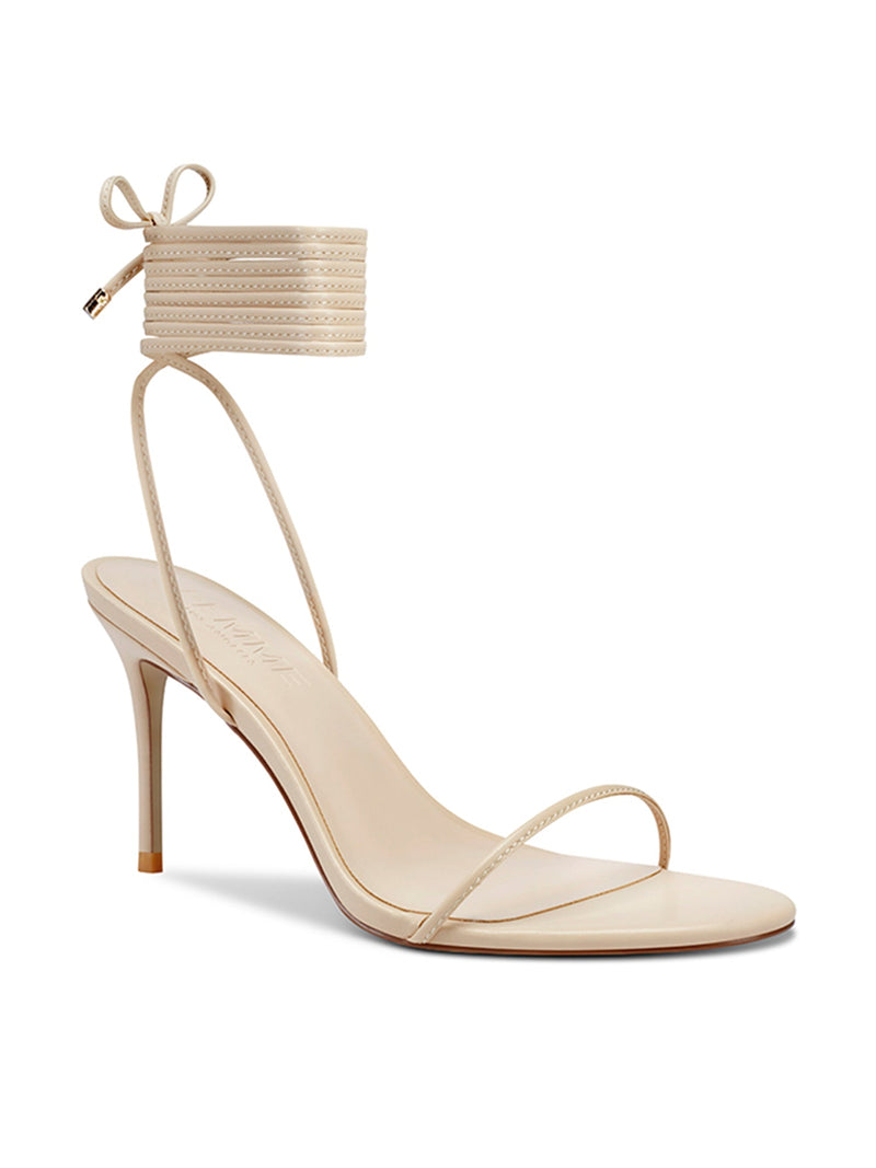 Femme LA 3.0 Barely There Lace Up in Nude – front three-quarter view showing nude lace-up ankle cuff, thin toe strap, and Femme LA branded insole