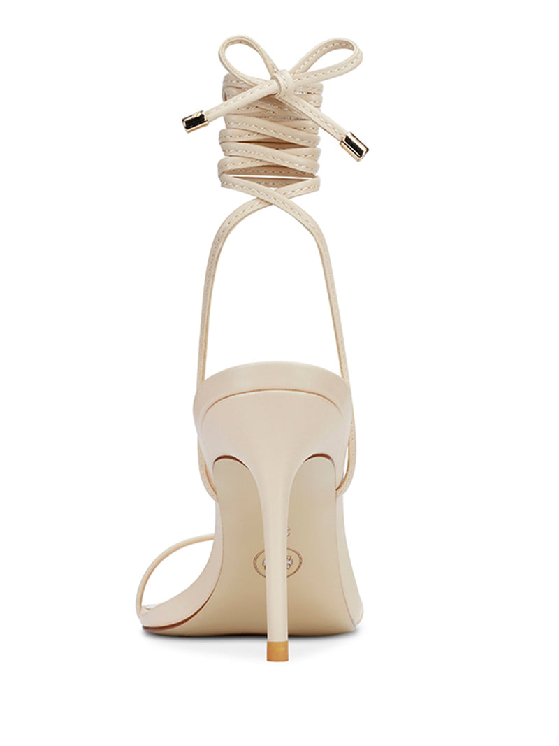 Femme LA 3.0 Barely There Lace Up in Nude – back view showing lace-up ankle cuff with gold-tipped aglets tied in a bow and slim stiletto heel