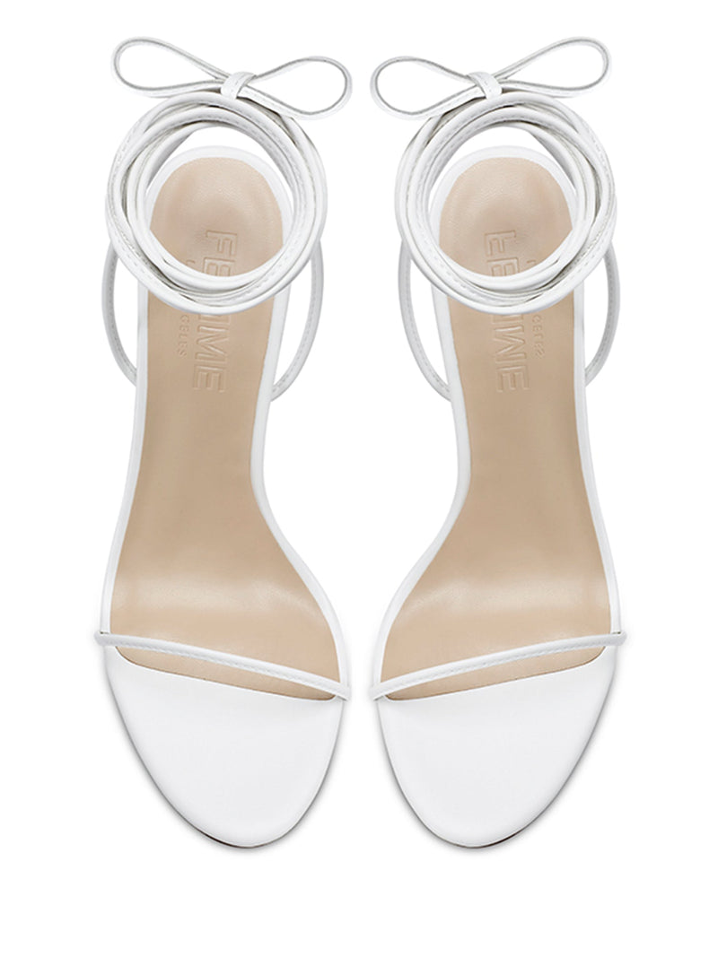 FEMME LA 3.0 Barely There Lace Up Heel in white — overhead view of the pair showing round toes, thin straps, and FEMME LOS ANGELES embossed insoles