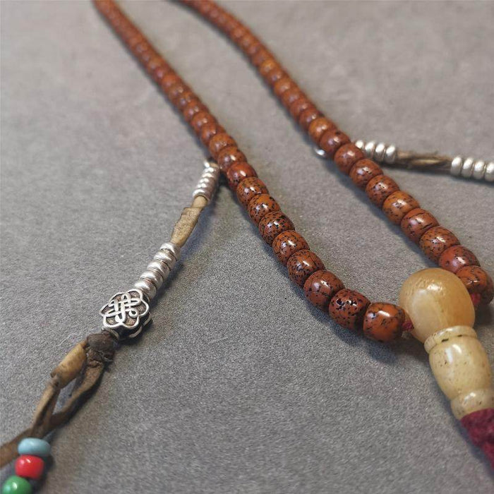 5mm Sterling Silver Prayer Bead Counters with Lucky Knot Pendant - Tibetan Buddhist art, close-up detail