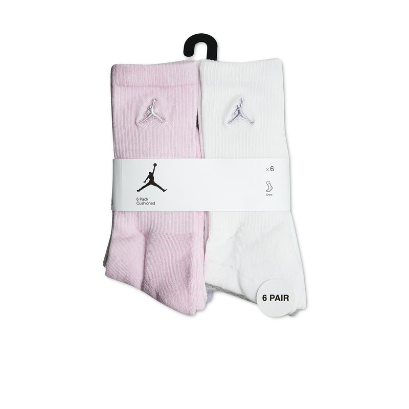6-pack crew socks in pink and white, folded and held by packaging band