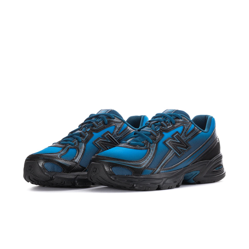 Men's New Balance lace-up sneakers, blue upper with black details and chunky sole.