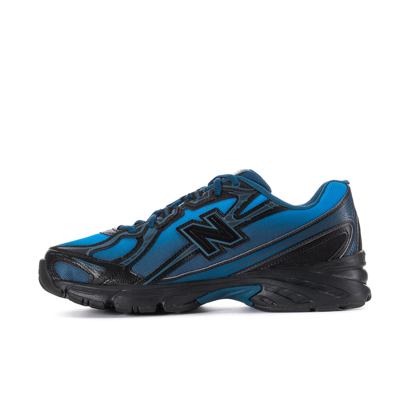 Men's New Balance sneakers side view, blue and black panels with lace-up design.