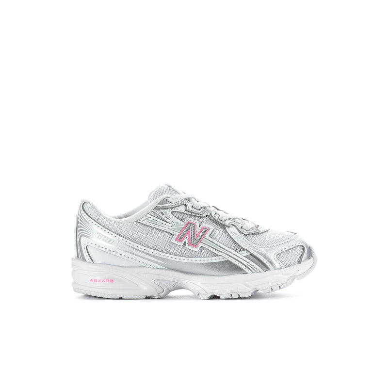 Silver toddler sneaker with pink N logo, lace-up design and chunky cushioned sole.