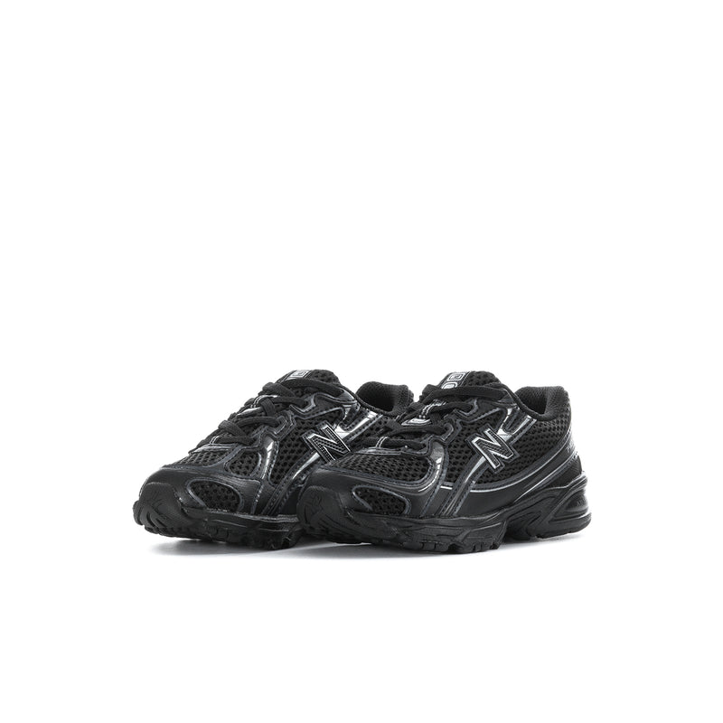Black toddler lace-up sneakers, side view with silver N logo and cushioned sole