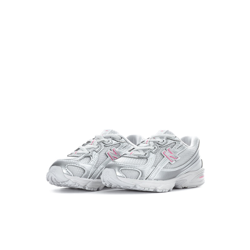 Silver toddler sneaker with pink N logo and padded collar, rear side view.
