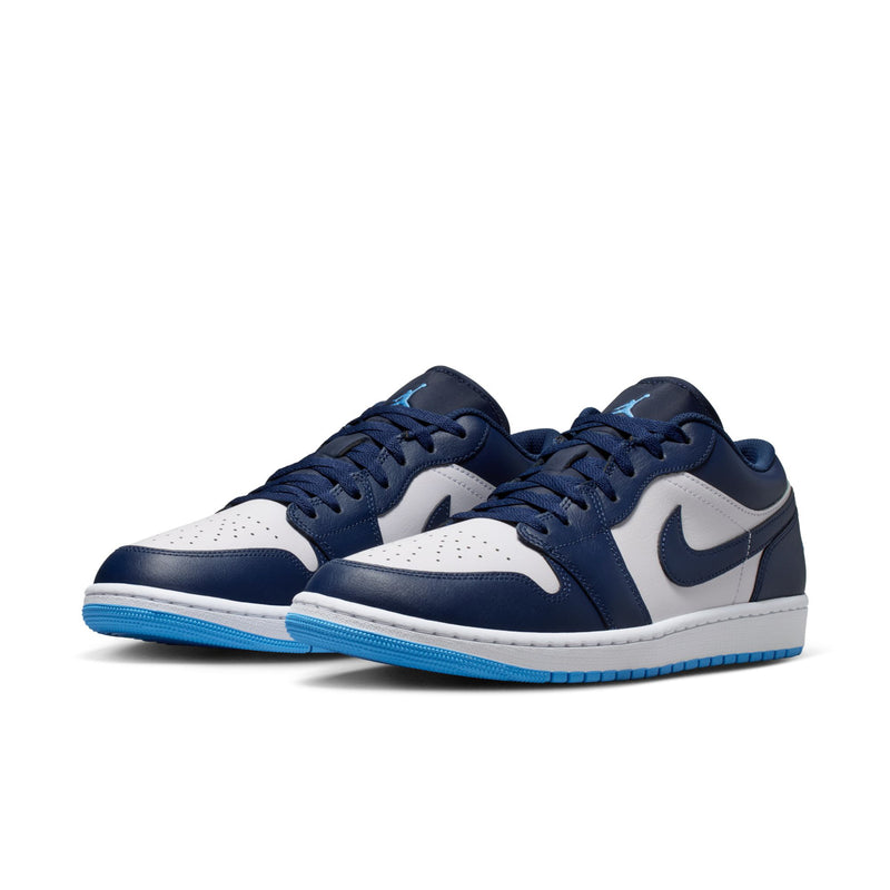 Men's low-top sneakers side view, navy and white uppers with blue rubber sole.