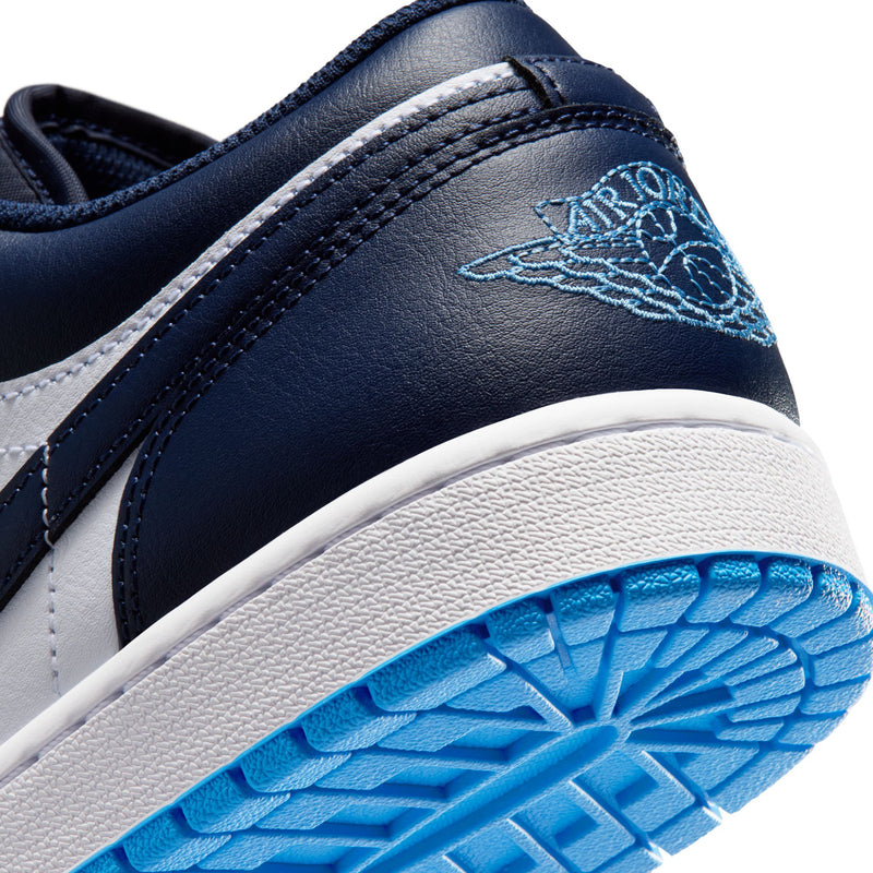 Close-up of men's sneaker heel, navy leather with light-blue Air Jordan wing logo.