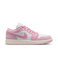 Women's low-top sneakers in pink and white with lace-up front and swoosh logo