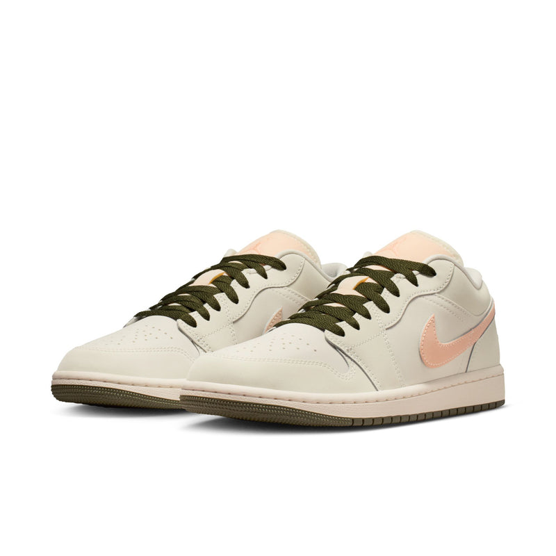 Women's low-top sneaker, off-white leather upper with pink Nike swoosh and olive laces