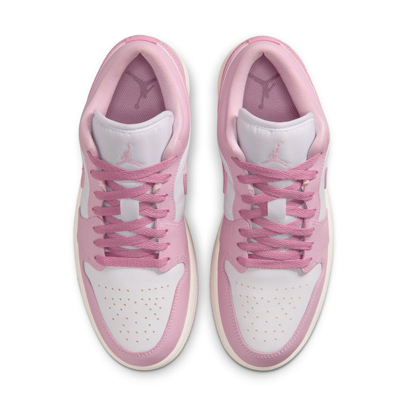 Pair of women's sneakers showing padded tongue and lace eyelets in pink