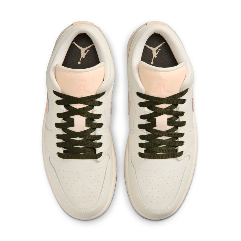 Women's low-top sneakers front view with olive laces, off-white leather, and pink accents