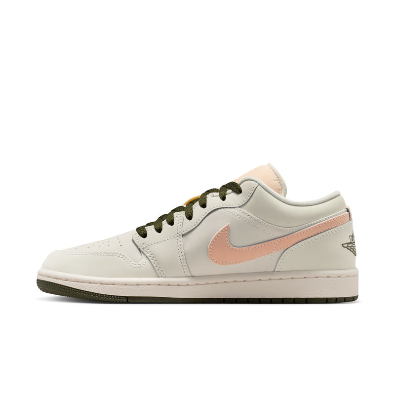 Women's low-top sneaker side view in off-white with pink swoosh and olive lace-up