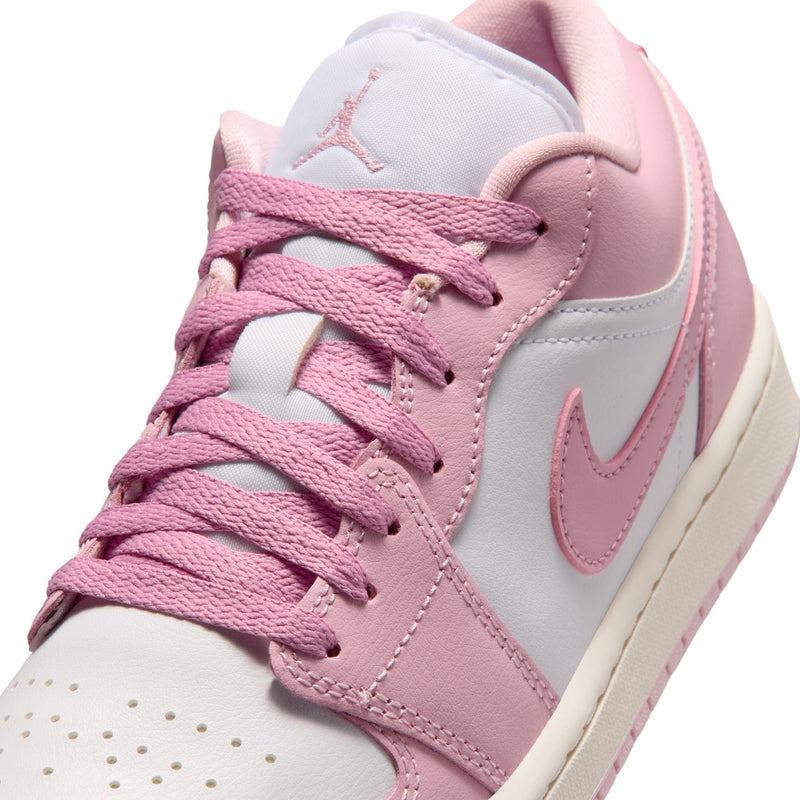 Women's sneaker upper close-up with pink laces, lace guard, and swoosh
