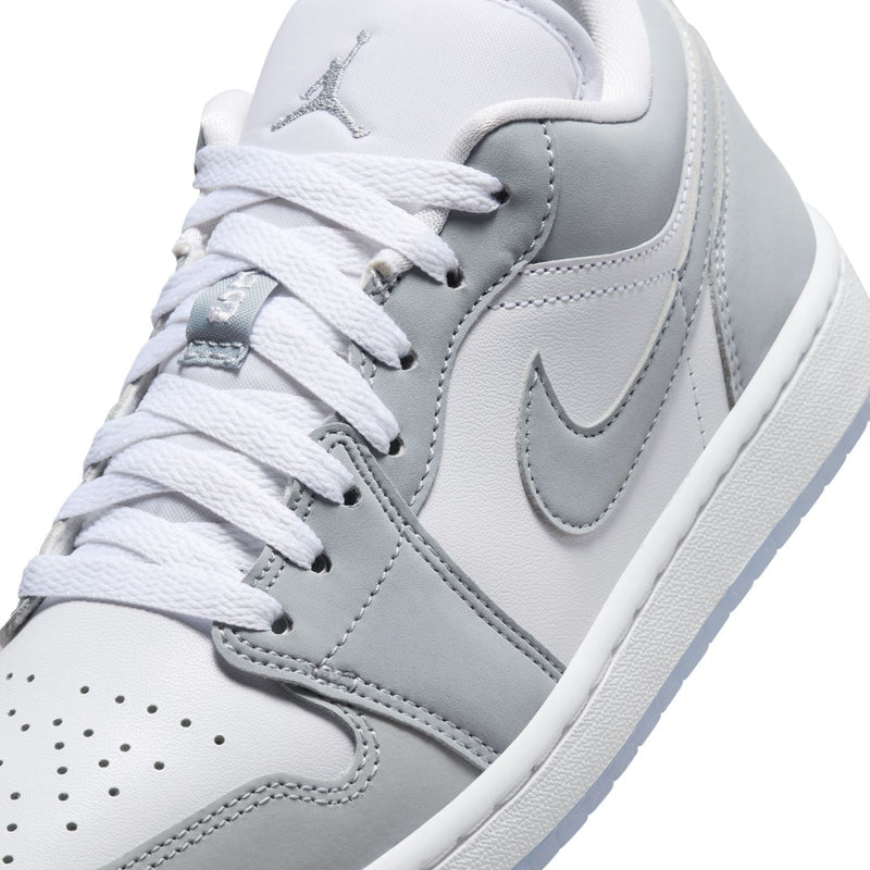 Women's Air Jordan 1 low-top sneakers close-up, gray Swoosh and white laces