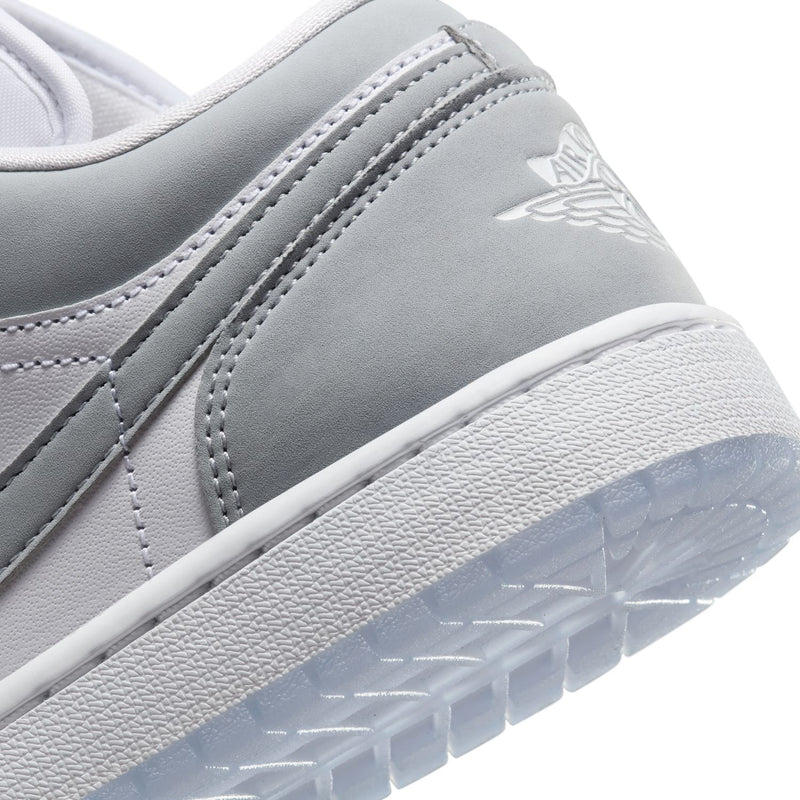 Women's Air Jordan 1 low-top sneakers close-up, gray heel panel with Air logo