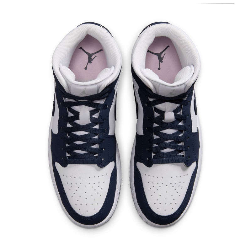Navy and white mid-top sneakers, front view with white laces and padded collars