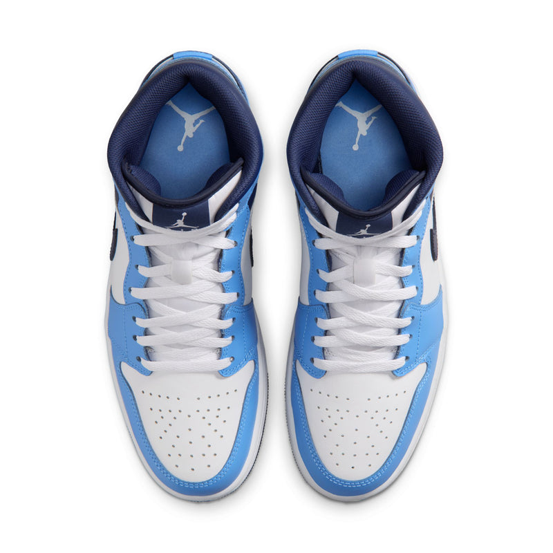 Pair of men's mid-top sneakers, top view, white laces and blue interior lining