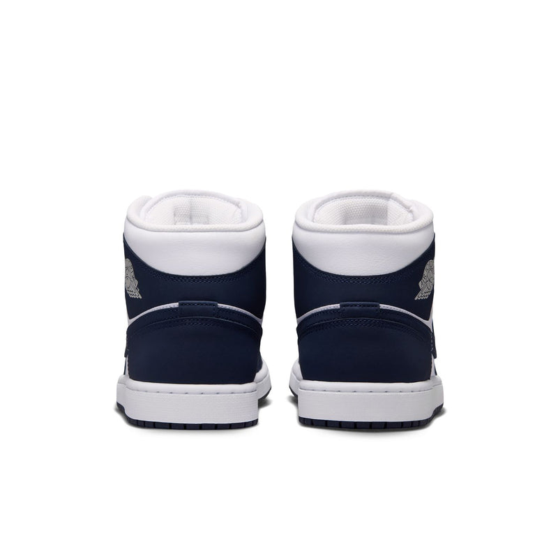 Back view of navy and white mid-top sneakers with cushioned heel and logo