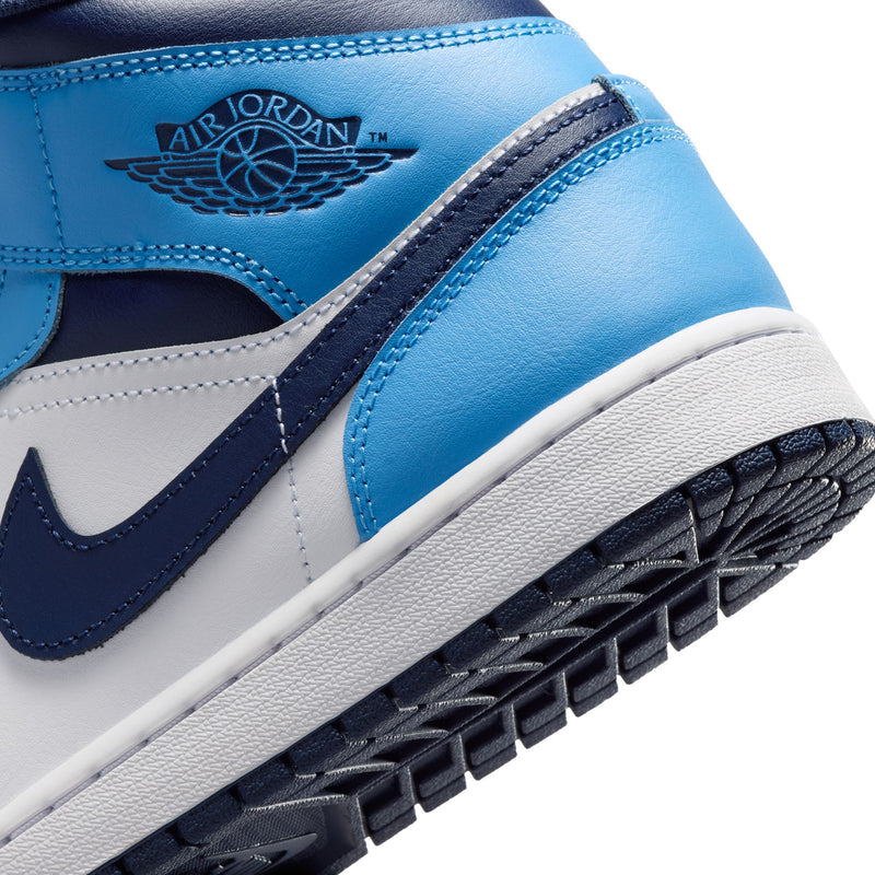 Men's mid-top sneaker close-up with Air Jordan wing logo and navy midsole trim