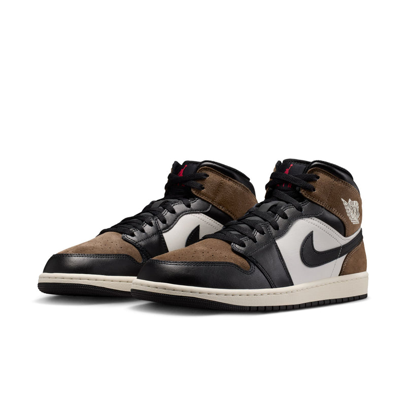 Pair of mens mid-top sneakers, tan and black suede uppers with white Swoosh and laces