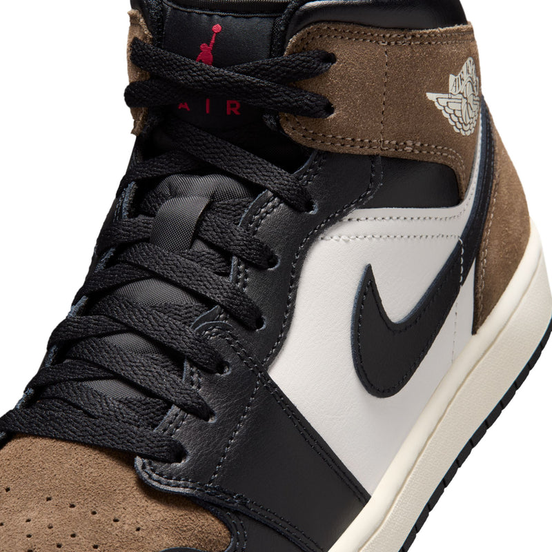 Close-up of mens mid-top laces and collar; black laces with tan suede and white Swoosh