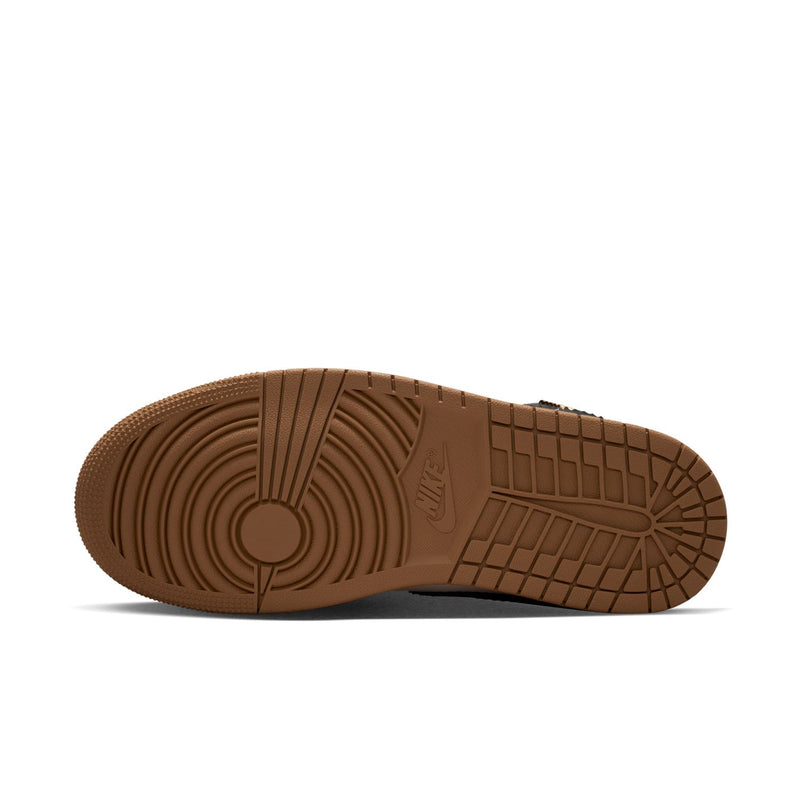 Outsole view of women’s mid-top sneakers with brown gum traction tread
