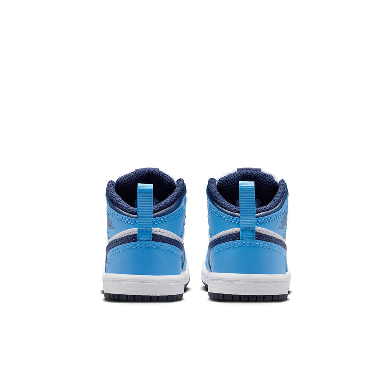 Toddler mid-top sneakers showing heel, light blue upper with dark navy collar
