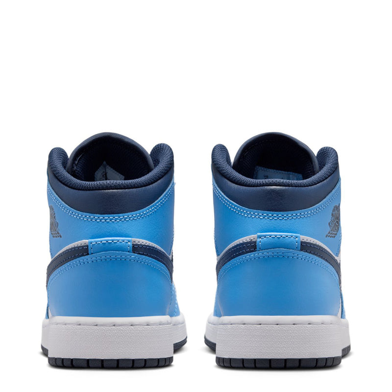 Youth mid-top sneakers shown from the heel: blue upper with white midsole trim.