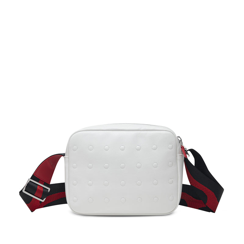 White leather-look crossbody bag with embossed dots, red accents, and plaid strap