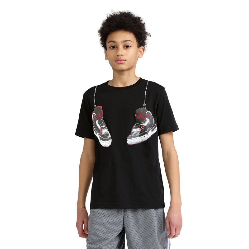 Black youth T-shirt with front sneaker graphic, red/white details, crew neck