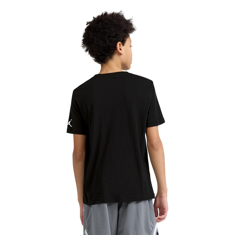 Black youth T-shirt back view with small sneaker print at left shoulder