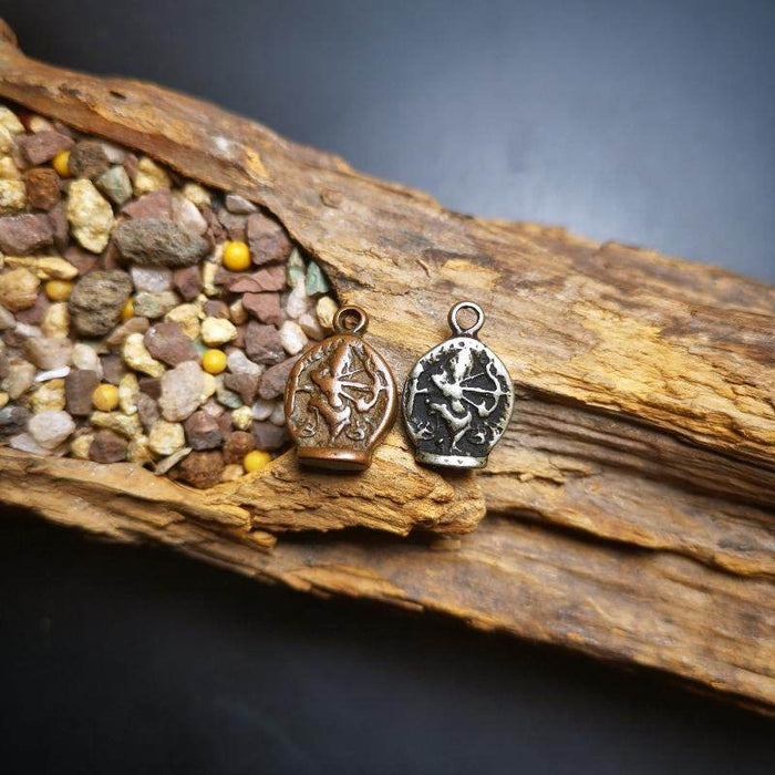 Amulet,Kurukulla Pendant - Tibetan Buddhist amulet, close-up detail