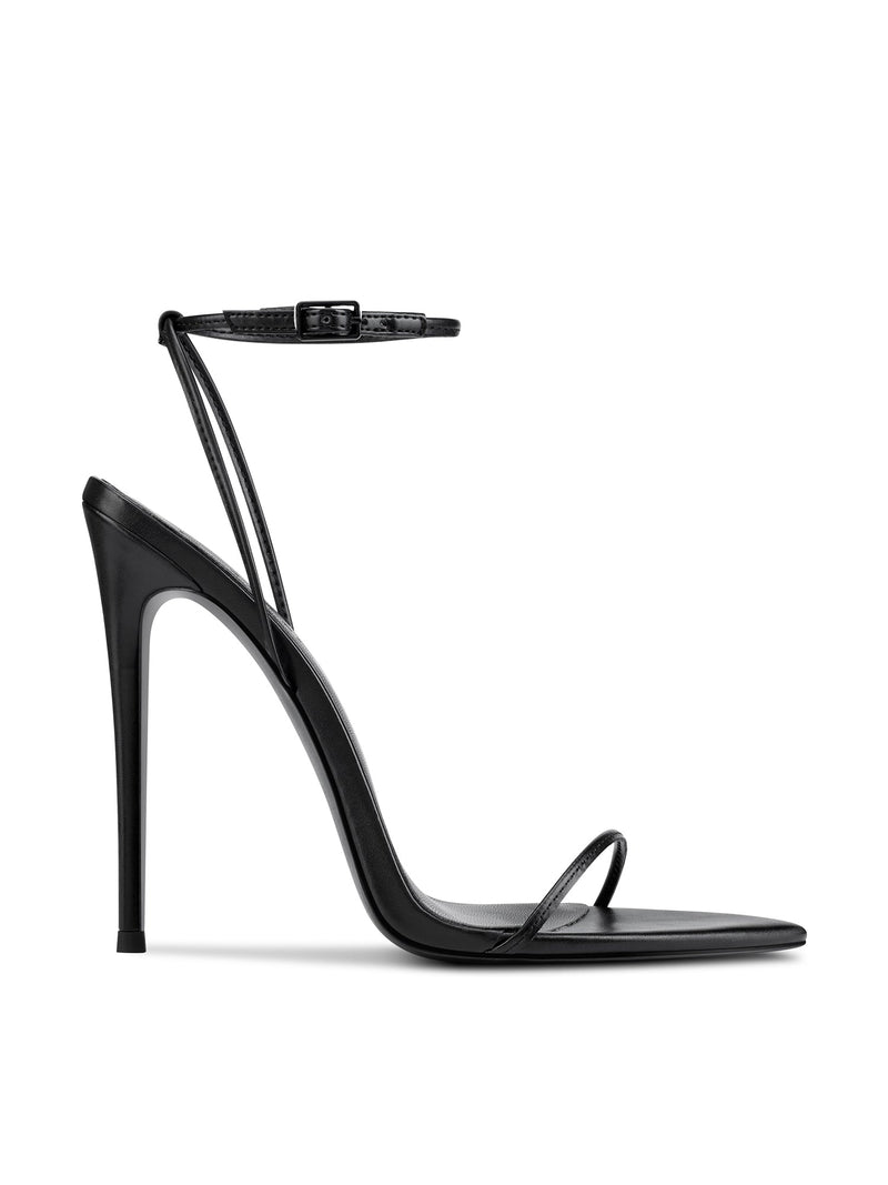 Black barely-there strappy stiletto sandal by FEMME LA, side view showing ultra-slim heel, ankle strap with buckle, and single toe strap