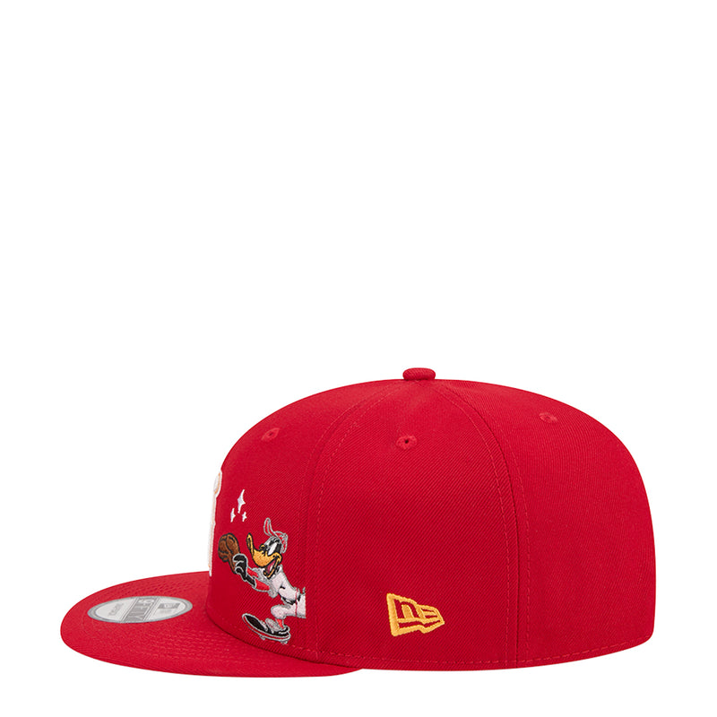Red snapback baseball cap with Daffy Duck patch and New Era logo badge