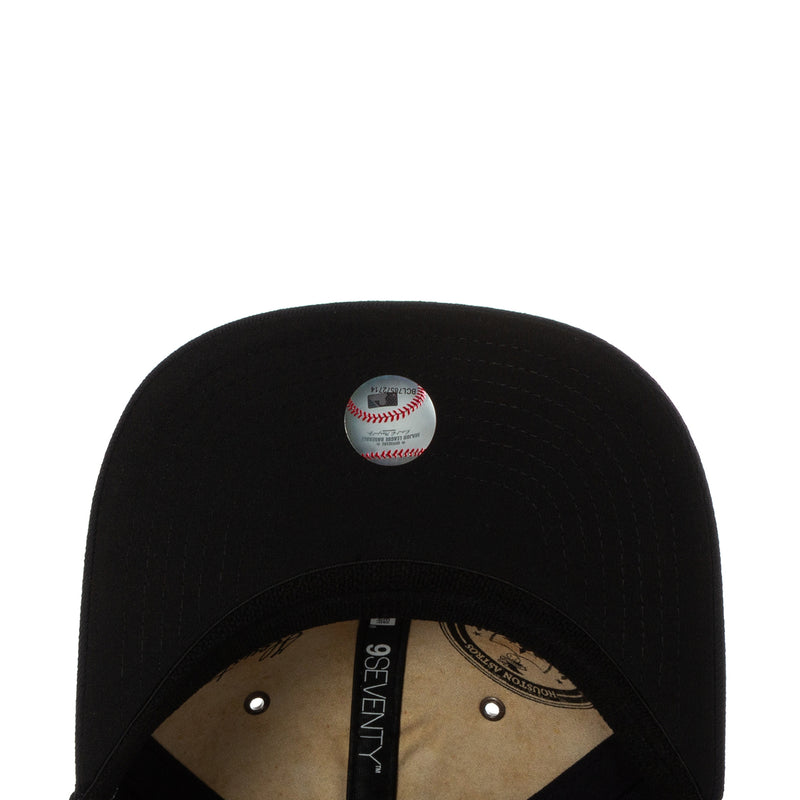 Dark baseball cap top with stitched button and open back mesh panel