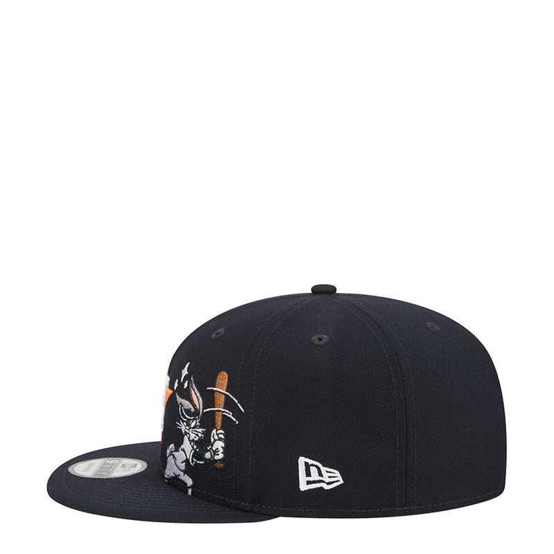 Black snapback cap with Bugs Bunny graphic on side and New Era logo on front