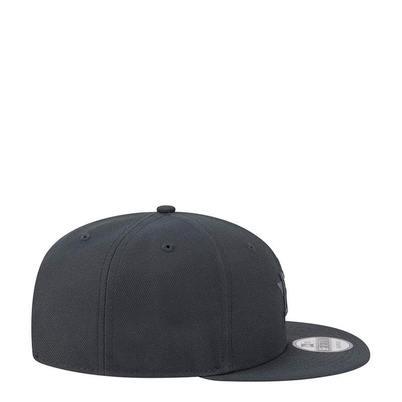 Dark gray baseball cap, side view with small stitched logo and curved brim