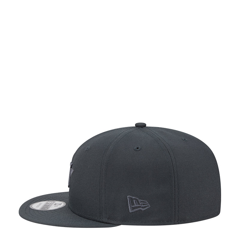 Dark gray baseball cap, front-side view with small embroidered logo patch