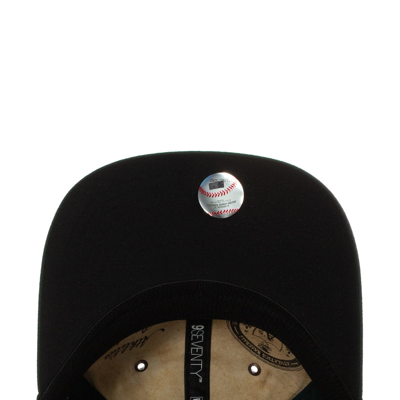 Black stretch-snap baseball cap with white baseball emblem on top