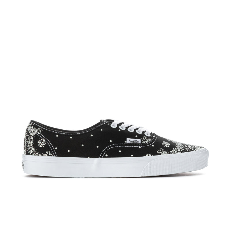 Black Vans low-top lace-up sneakers with white bandana print and white rubber sole