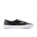 Black Vans low-top lace-up sneakers with white bandana print and white rubber sole