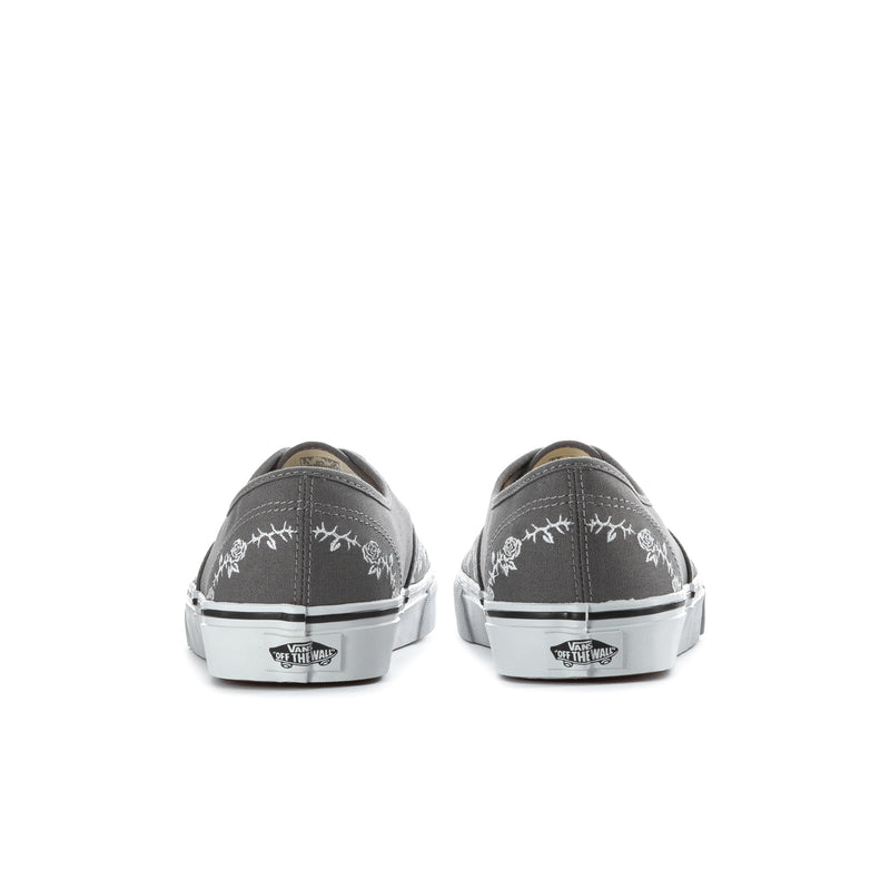 Back view of men's dark gray canvas sneakers with heel branding and white soles